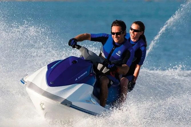 Jet ski cutting across clear shallow water off Boracay on a water sports tours package, Philippines