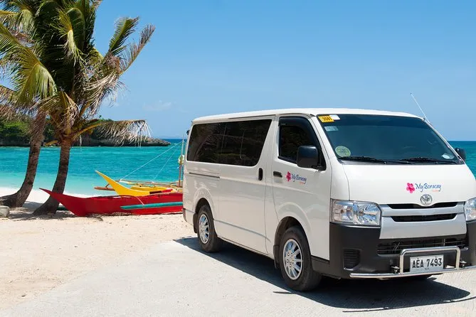 Van and porters at Caticlan Jetty Port on a one-way Boracay transfer tours package, Philippines